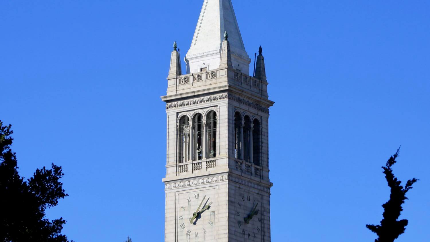 The UC Berkeley Campanile, Sather Tower, clock tower against a blue sky &mdash; EMF radiation testing and shielding help for Berkeley homes