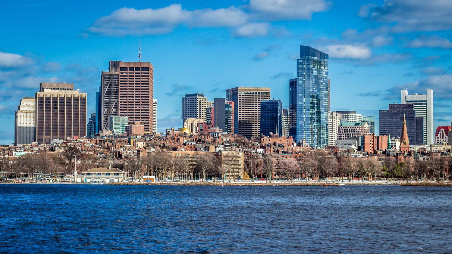 Boston, Massachusetts skyline across the Charles River with Back Bay brownstones below downtown towers — EMF radiation testing and shielding help for Boston homes
