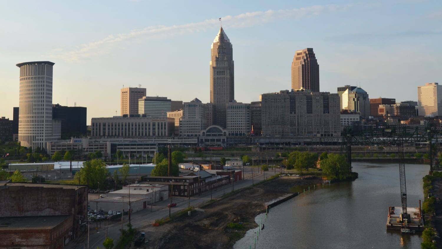 Downtown Cleveland, Ohio skyline with Terminal Tower and Key Tower over the Cuyahoga River — EMF radiation testing and shielding help for Cleveland homes