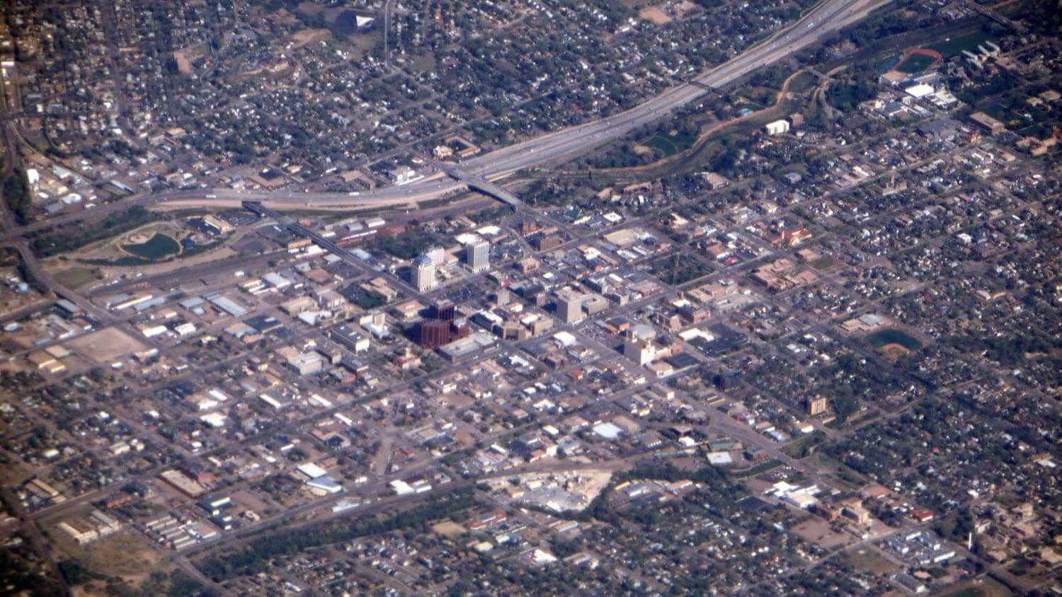 Aerial view over downtown Colorado Springs, Colorado and its street grid &mdash; EMF radiation testing and shielding help for Colorado Springs homes