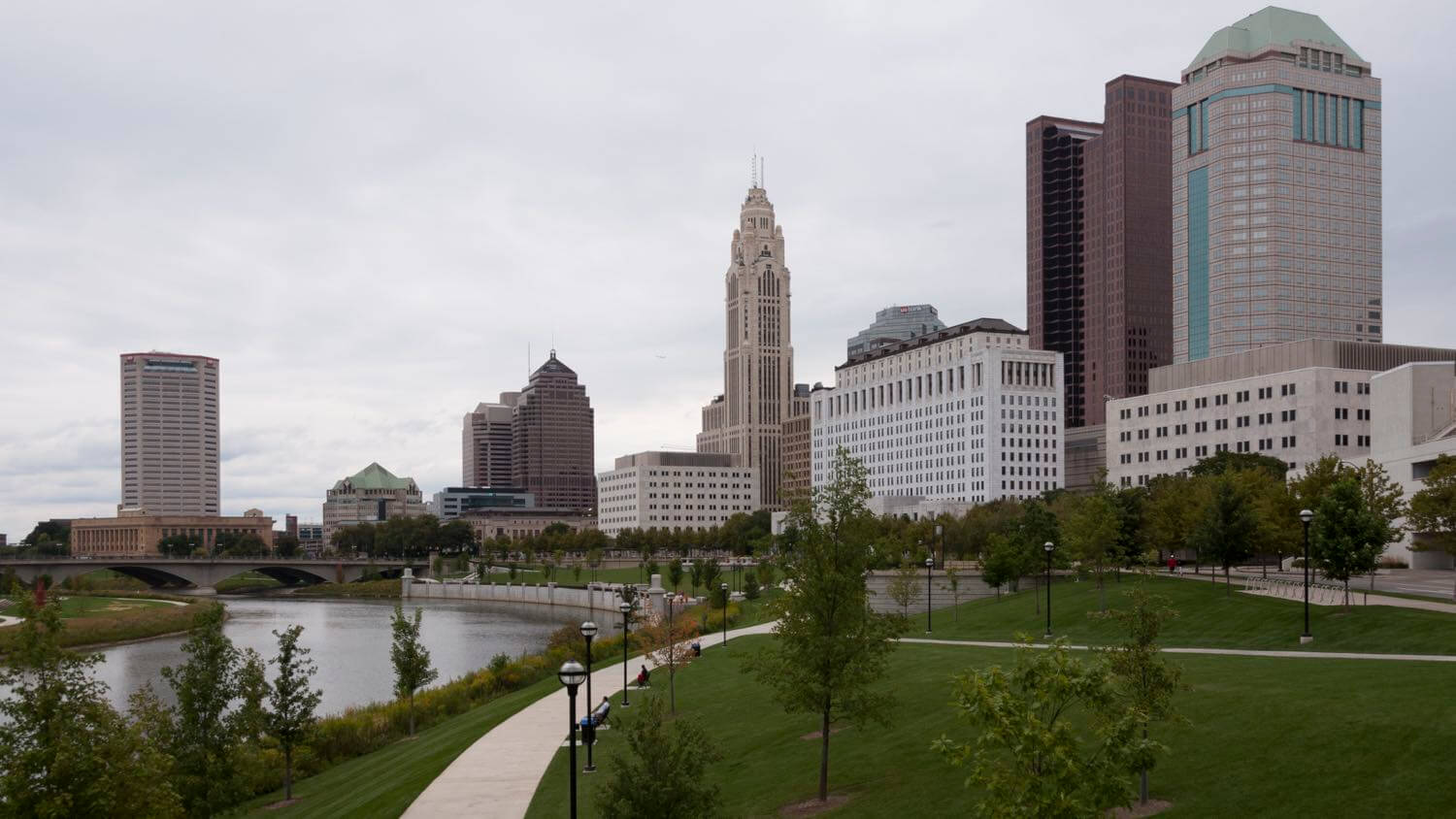 Downtown Columbus, Ohio skyline with the LeVeque Tower over the Scioto River and riverfront park — EMF radiation testing and shielding help for Columbus homes