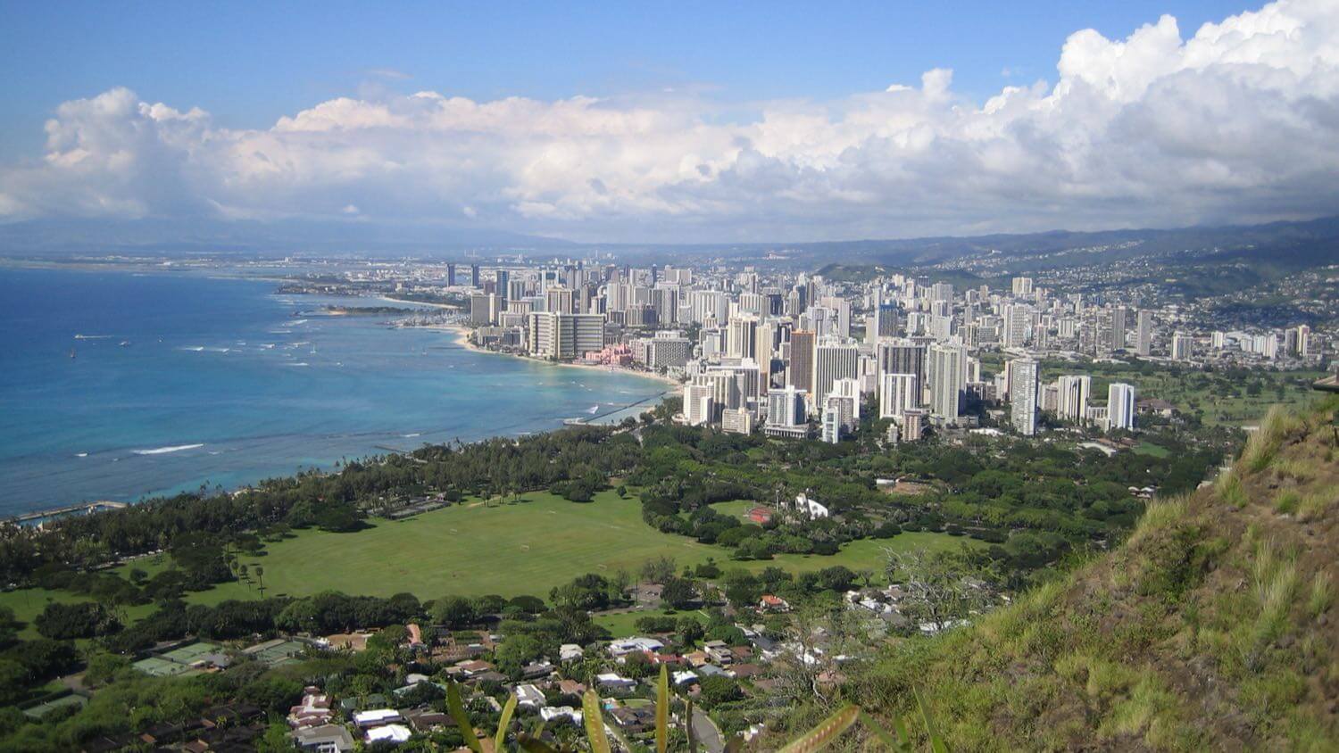 Honolulu and Waikiki from Diamond Head, with high-rise hotels along the beach and the ocean beyond — EMF radiation testing and shielding help for Honolulu homes