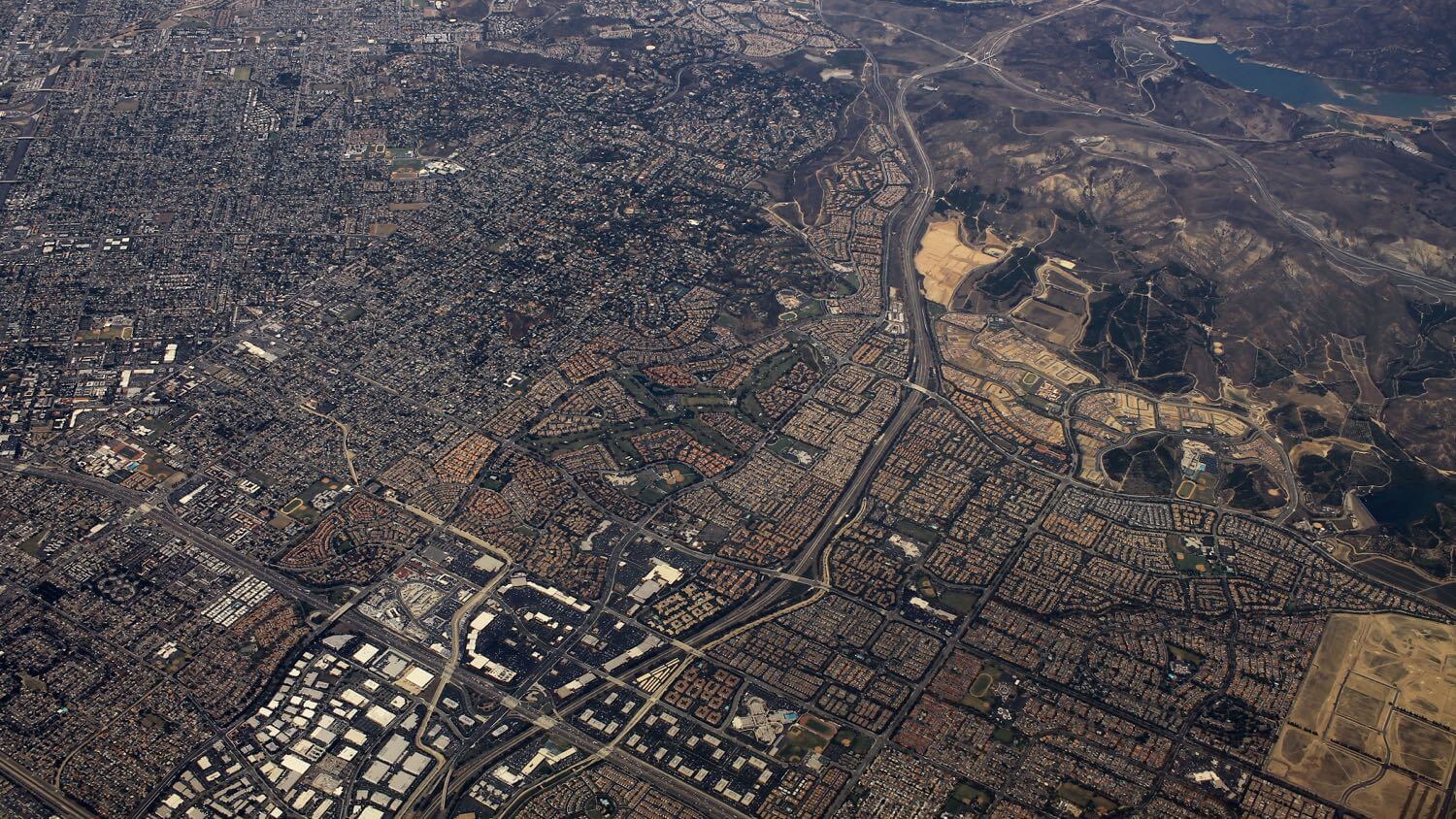 Aerial view of Irvine, California’s master-planned Orange County neighborhoods with curving streets and planned villages — EMF radiation testing and shielding help for Irvine homes