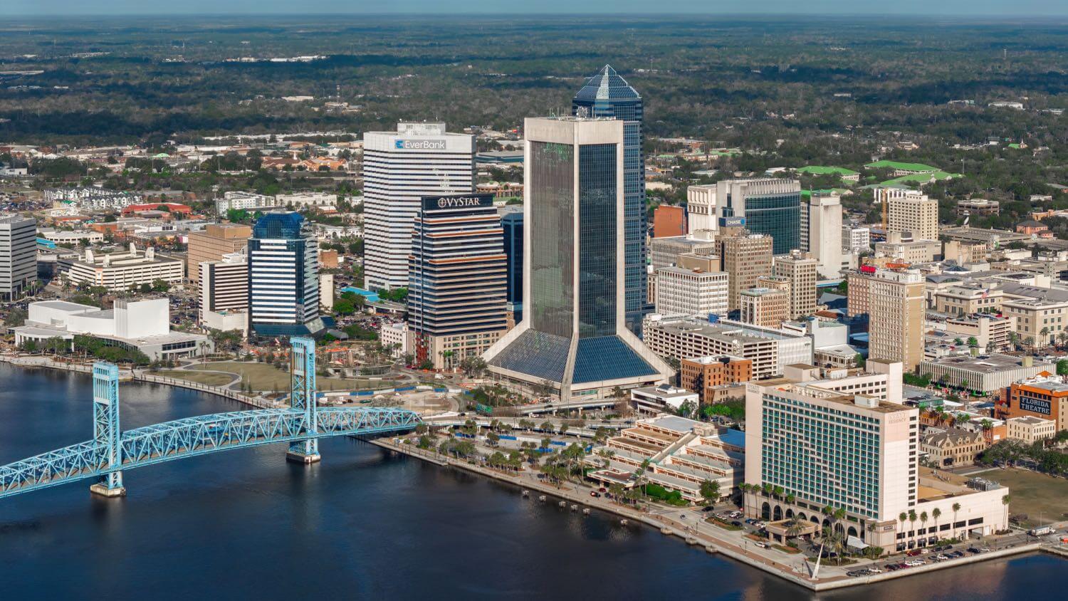 Downtown Jacksonville, Florida skyline on the St. Johns River with the blue Main Street Bridge — EMF radiation testing and shielding help for Jacksonville homes