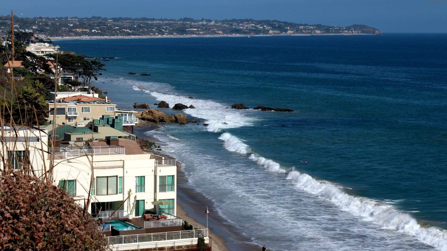 The Malibu, California coastline with beachfront homes along the Pacific — EMF radiation testing and shielding help for Malibu homes