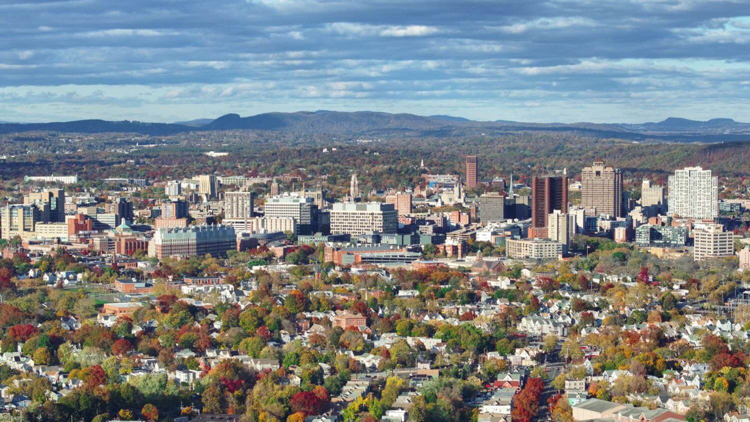 Downtown New Haven, Connecticut and Yale’s towers amid the autumn tree canopy — EMF radiation testing and shielding help for New Haven homes