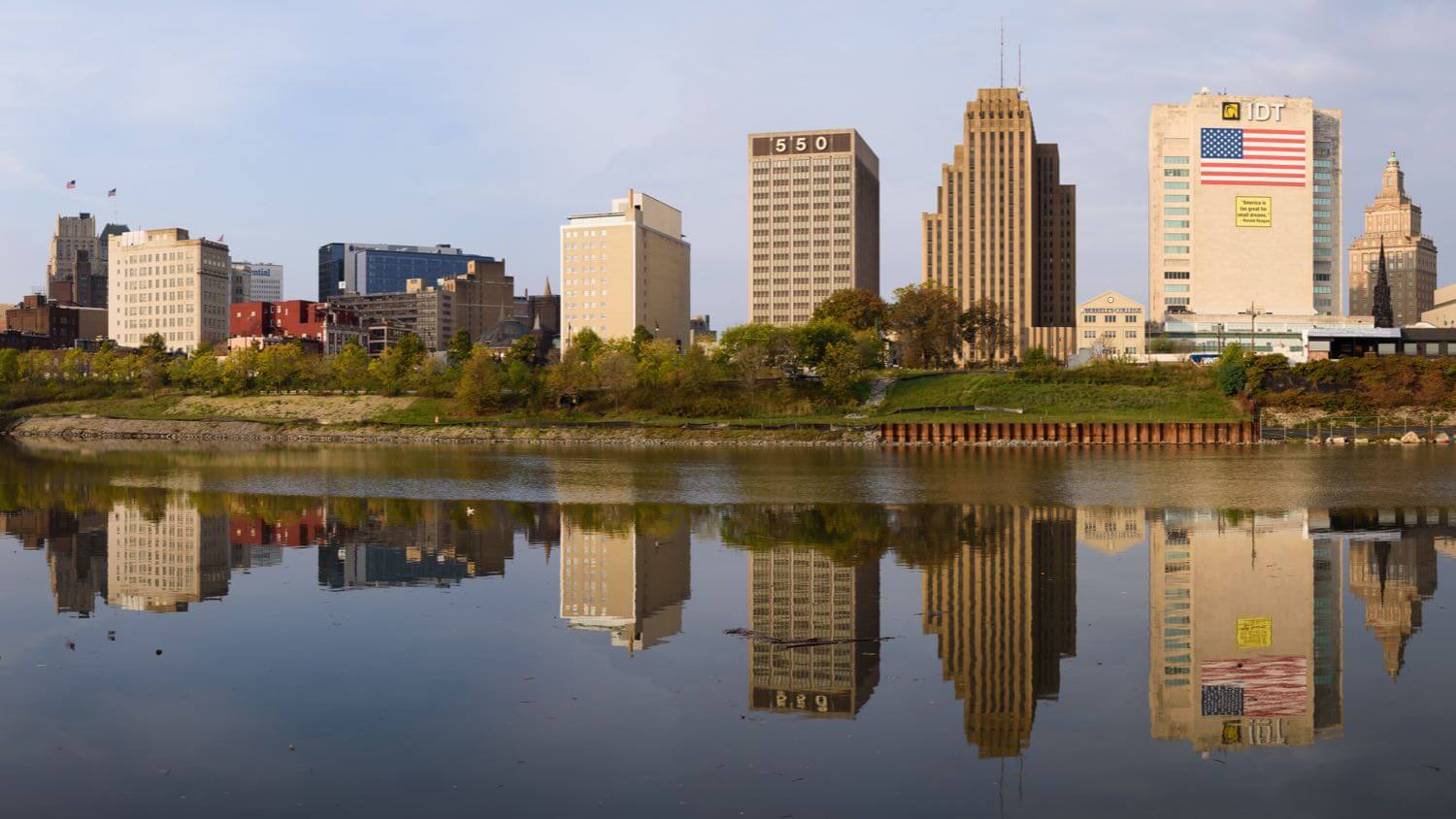 The downtown Newark, New Jersey skyline reflected in the Passaic River — EMF radiation testing and shielding help for Newark homes
