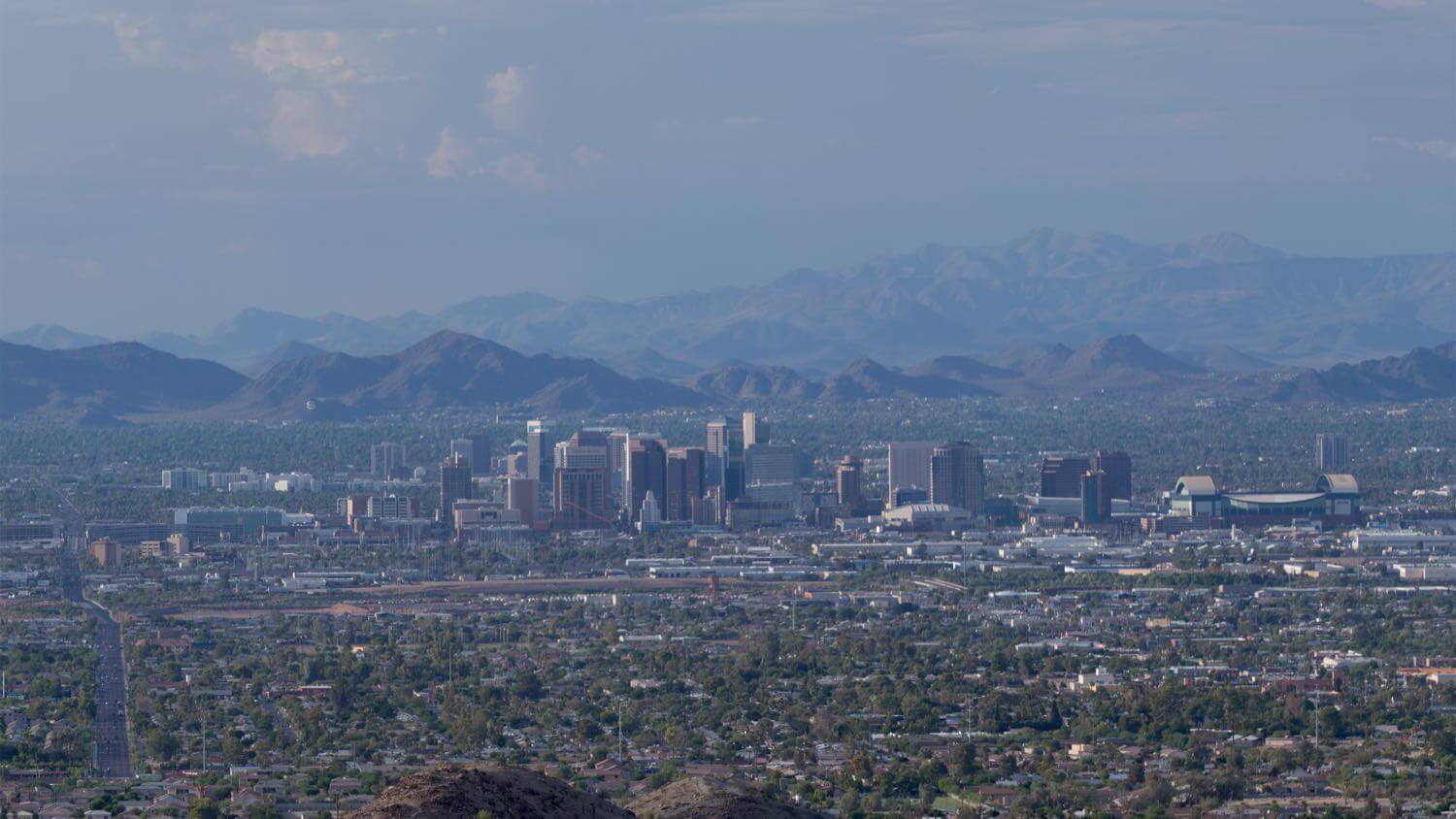 Downtown Phoenix, Arizona skyline ringed by desert mountains — EMF radiation testing and shielding help for Phoenix homes