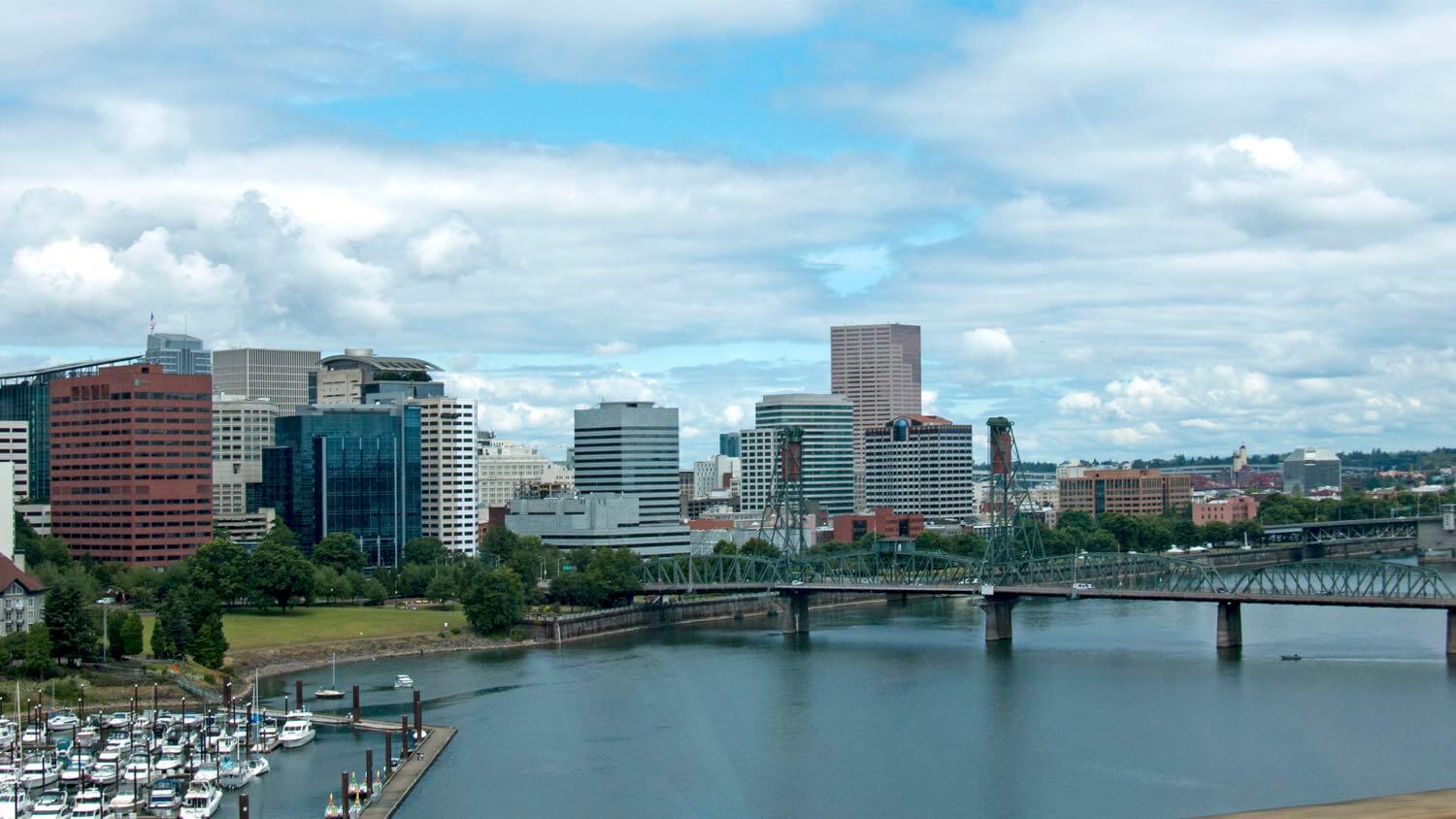 Downtown Portland, Oregon skyline across the Willamette River with the Hawthorne Bridge &mdash; EMF radiation testing and shielding help for Portland homes