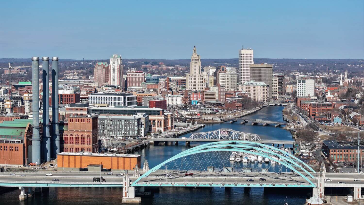 Downtown Providence, Rhode Island skyline with the Superman Building, river and teal bridge — EMF radiation testing and shielding help for Providence homes