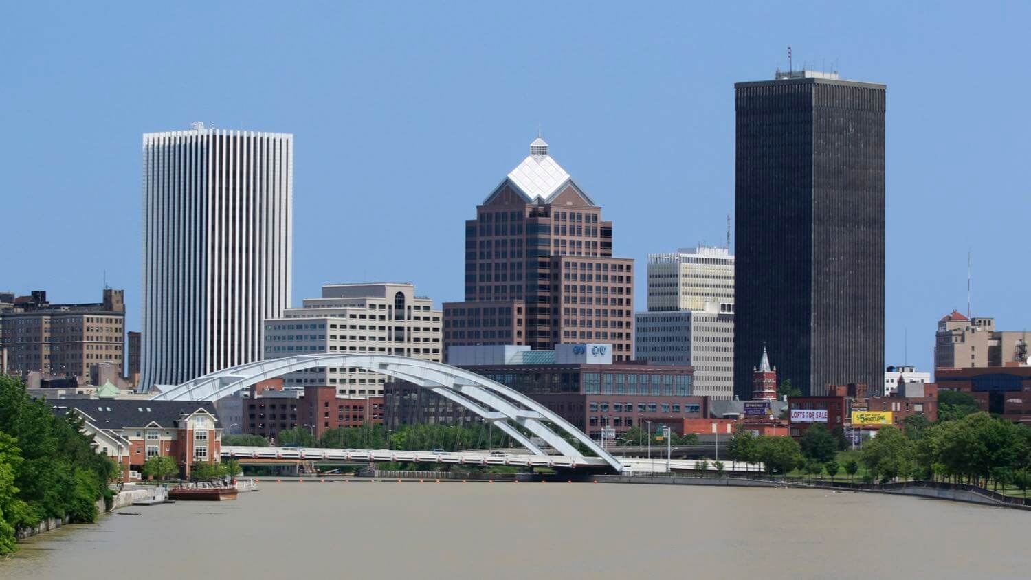 Downtown Rochester, New York skyline with the Frederick Douglass-Susan B. Anthony Memorial Bridge over the Genesee River — EMF radiation testing and shielding help for Rochester homes