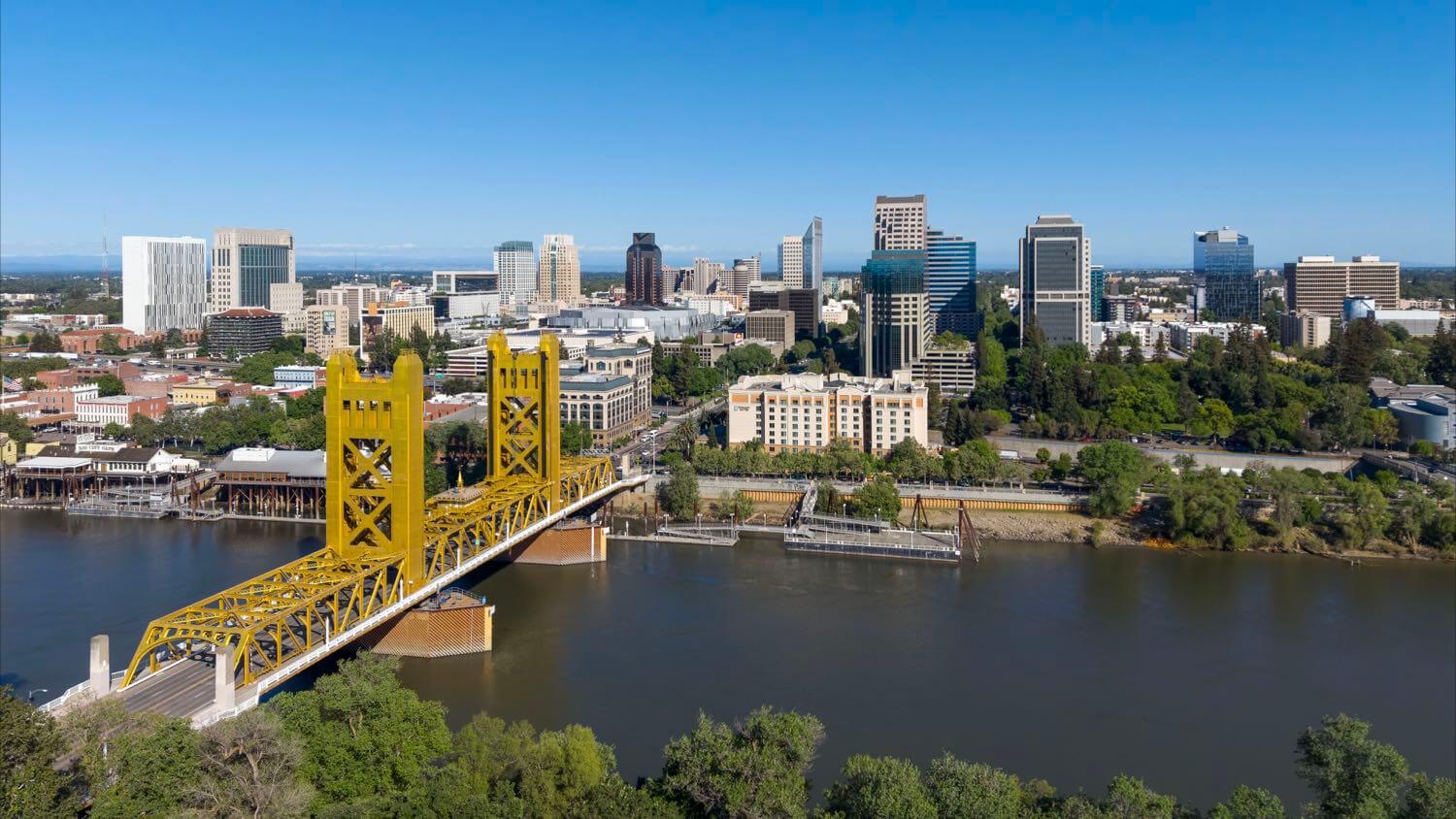 Downtown Sacramento, California skyline with the Tower Bridge over the Sacramento River &mdash; EMF radiation testing and shielding help for Sacramento homes