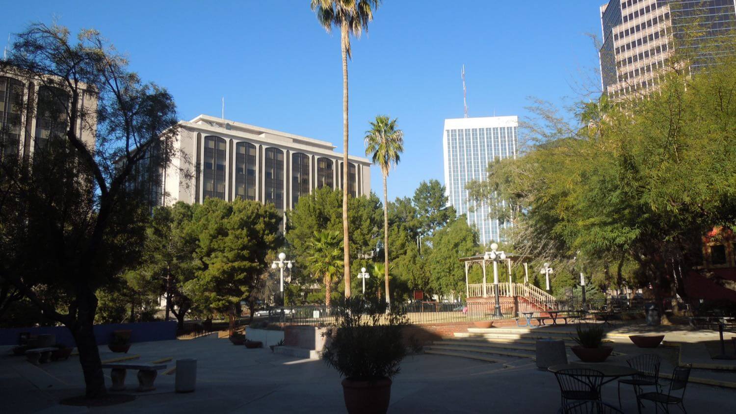 Downtown Tucson, Arizona with palm trees, a plaza and office towers — EMF radiation testing and shielding help for Tucson homes
